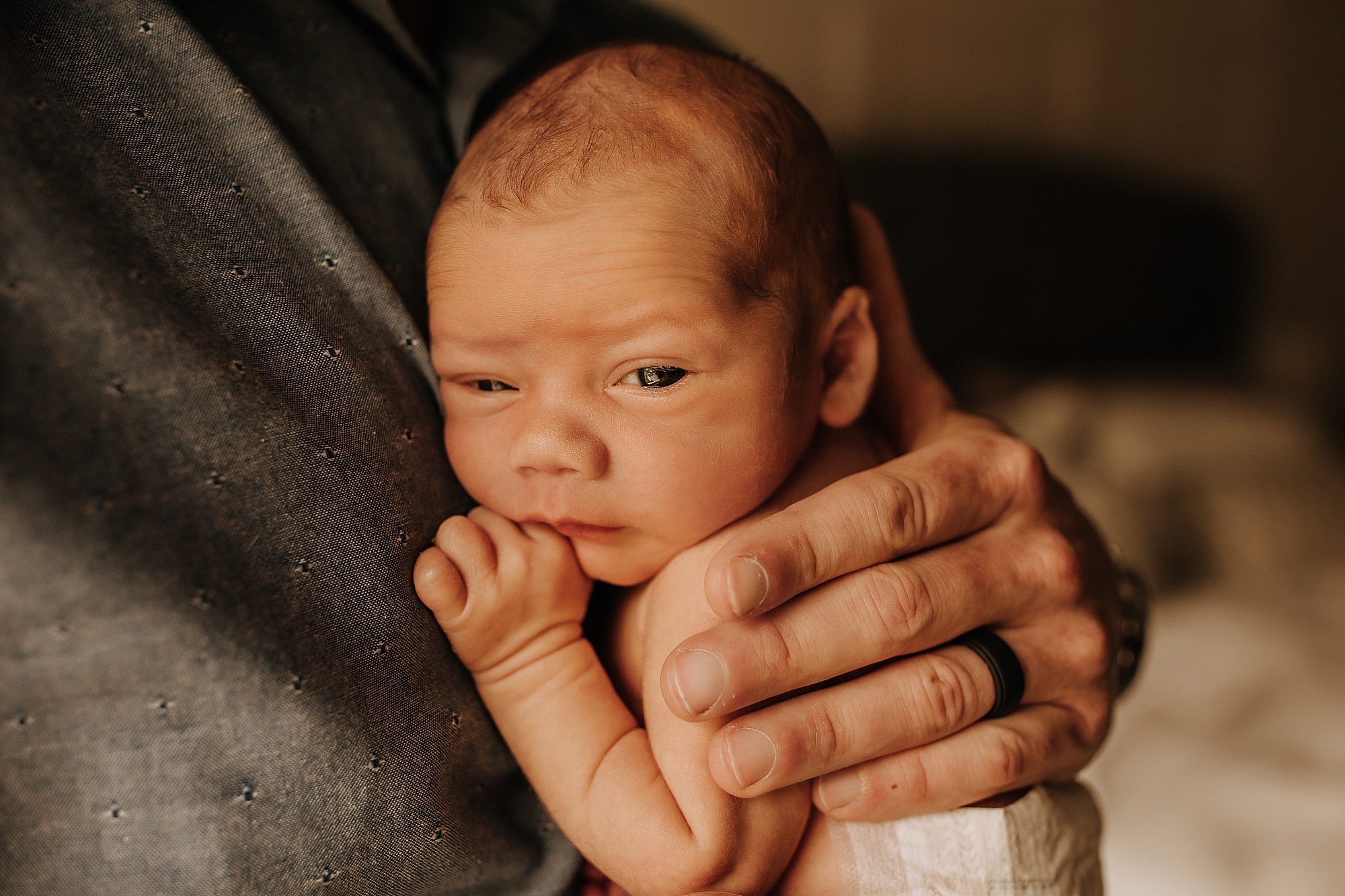 BABY IN DADS HANDS